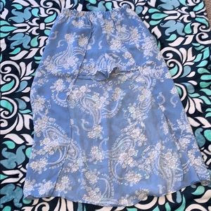 Blue shorts with something hanging from the shorts